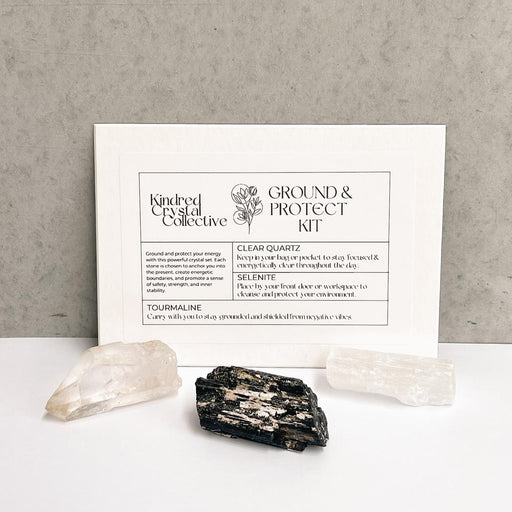 Ground and Protect Kit with crystals on a gray background